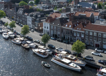 Feadship Heritage Fleet brought together in The Netherlands, MTB Events, image shows the Haarlem Spaarne River with a collection of superyachts sailing and moored up
