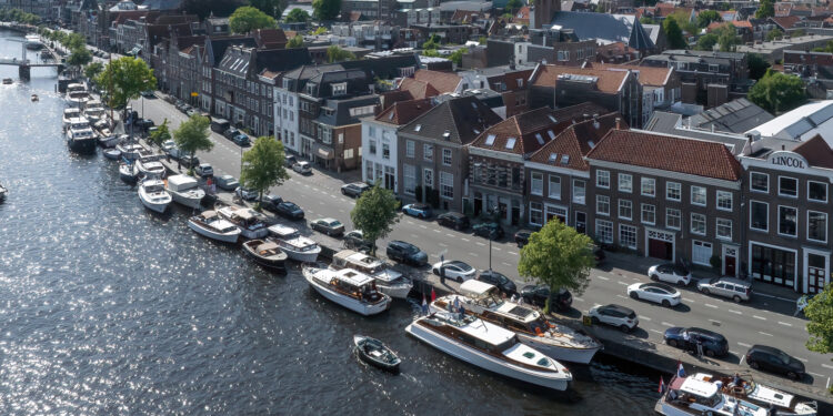 Feadship Heritage Fleet brought together in The Netherlands, MTB Events, image shows the Haarlem Spaarne River with a collection of superyachts sailing and moored up