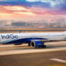 IndiGo places record breaking order for 500 A320 Family aircraft, MTB Events, Image shows an IndiGo airplane on a runway at sunset