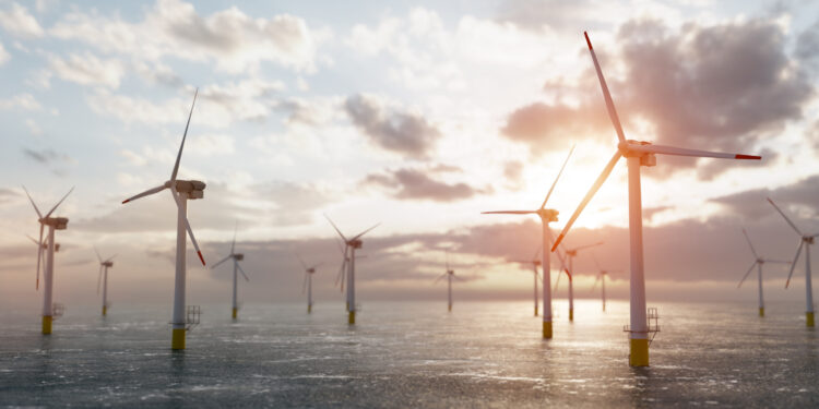 Partnership created between ESB and Ørsted in landmark Irish offshore wind agreement, MTB Events, image shows offshore wind farm, calm seas and sunrise