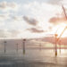 Partnership created between ESB and Ørsted in landmark Irish offshore wind agreement, MTB Events, image shows offshore wind farm, calm seas and sunrise