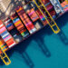 Metizoft to provide Strategic Marine Group with ESG application service, MTB Events, image shows aerial view of a cargo ship container harbour with colourful containers and bright blue sea