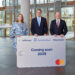 Lufthansa and Miles & More form a new alliance with Deutsche Bank and Mastercard, MTB events. Image shows members of each company holding a large replica of the Miles & More card