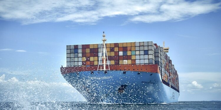 Volvo change to renewable fuel for ocean freight, cutting CO2 emissions by 84%, MTB Events, Image shows a large ship carrying colourful freight boxes on the ocean with ocean spray in the fore front and light cloud in the background