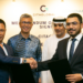 Masdar & Citiglobal Berhand sign MoU to develop renewable energy across Malaysia, MTB Events. Image shows Abdulla Zayed and Tan Sri (Dr) Mohamad Norza Zakaria shaking hands in front of Yang Berhormat Mulia Datuk Seri Utama Tengku Zafrul Aziz HE Khalid Ghanim Mohammed Alghaith. In the background there is a large poster with Citigroup and Masdar logos.
