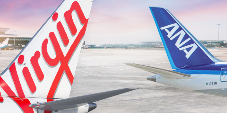 Expanded partnership between Virgin Australia & ANA offers even more benefits for passengers, MTB Events. Image shows two tails of two planes, one with the text 'Virgin' in red like the logo, the other is blue with 'ANA' in white text. Both are on tarmac at sunrise.