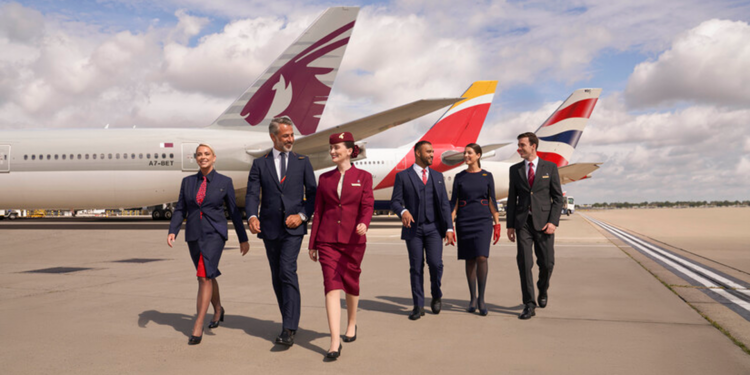 Iberia, British Airways & Qatar join together to form the world's largest Airline business, MTB Events, Image shows 6 people from airlines in front of each airlines plane lined up together on the runway