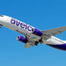 Avelo have begun their descent to San Juan, MTB Events, Image shows a plane in flight with the Avelo purple branding along the side