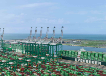 Taiwan celebrates first automated container terminal with Evergreen, MTB Events. Image shows Terminal 7 at Kaohsiung port, Taiwan. Lots of green containers on the portside and on three large shipping vessels