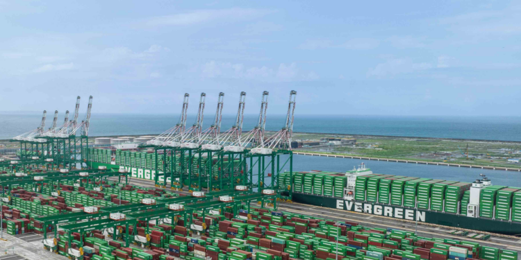 Taiwan celebrates first automated container terminal with Evergreen, MTB Events. Image shows Terminal 7 at Kaohsiung port, Taiwan. Lots of green containers on the portside and on three large shipping vessels