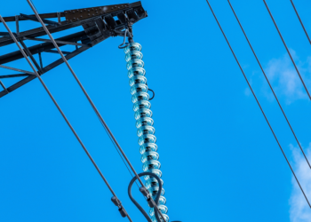 Ofgem have provisionally approved SSEN Transmission's proposals for Scotland, MTB News. Image shows a blue sky with thin power lines running across