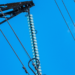 Ofgem have provisionally approved SSEN Transmission's proposals for Scotland, MTB News. Image shows a blue sky with thin power lines running across