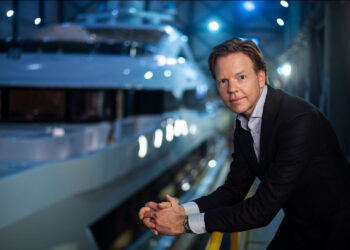 Heesen Yachts appoints Niels Vaessen as new CEO, MTB Events. Image shows Niels Vassen stood infront of a superyacht at night
