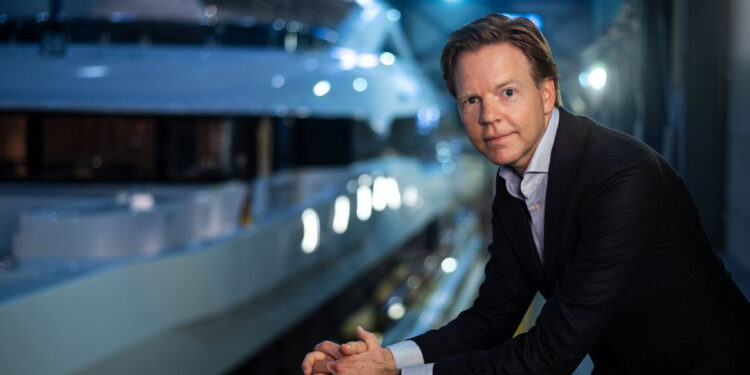 Heesen Yachts appoints Niels Vaessen as new CEO, MTB Events. Image shows Niels Vassen stood infront of a superyacht at night