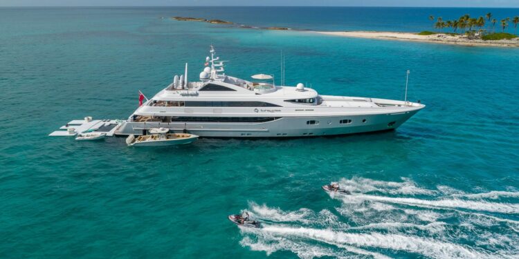 Major European expansions for FGI Yacht Group with new office in Monaco, MTB Events. Image shows 181-foot Superyacht called Turquoise in the sea with two jet skis.