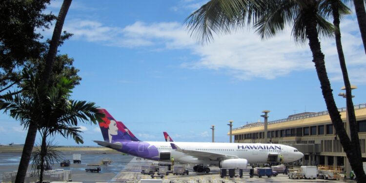 Alaska Air Group acquires Hawaiian Airlines creating more choice for travellers, MTB Events. Image shows an Hawaiian Airlines A330-200 at Honolulu International Airport, Oahu, Hawaii