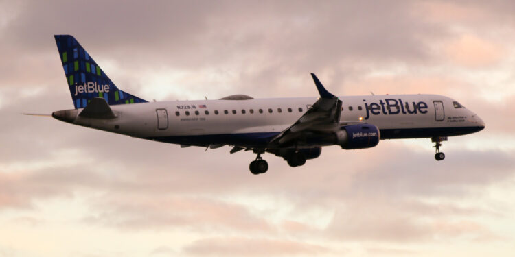 JetBlue to be the first US airline with a female CEO, MTB Events. Image shows a JetBlue flight at sunrise