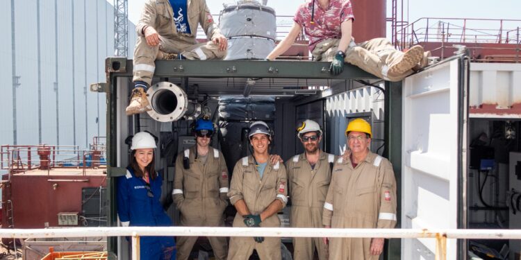 British climate tech startup successfully completes sea trials, MTB events. Image shows the a group of Seabound workers in and around a shipping container in Yalova, turkey.