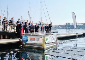 Further efforts to create 'responsible yachting' achieved by Yacht Club de Monaco, MTB Events. Image shows a group of people looking at the new technology on the water