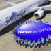 Senior VP for Alaska Airlines to be new CEO of the oneworld® alliance, MTB Events. Image shows Alaska Airlines plane on tarmac with a circle of people holding a large oneworld alliance logo