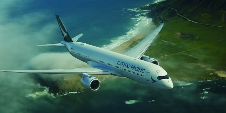 In support of its 2050 net-zero objective, Cathay sets a new 2030 carbon intensity target, MTB Events. Image shows a Cathay Pacific aircraft flying over a green coast