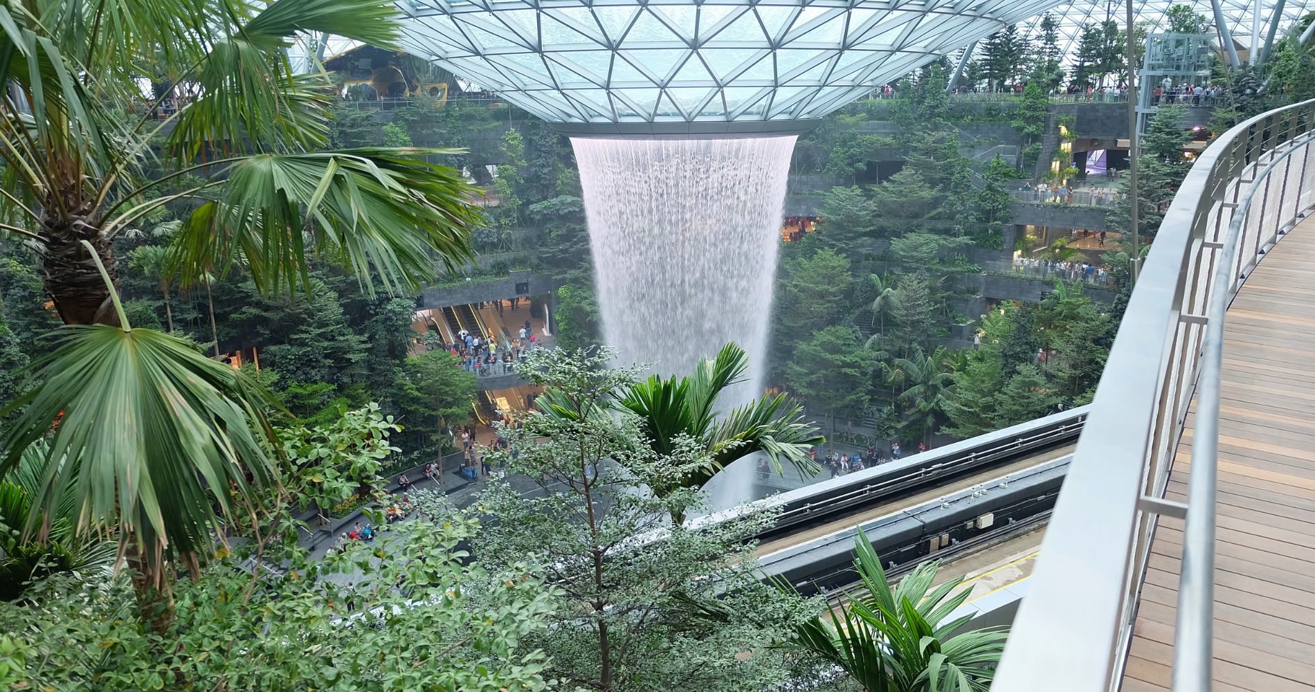 8 of the most beautiful airports in the world, MTB Events. Image shows Jewel Changi Airport's waterfall amongst tropical trees.