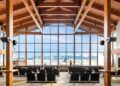 8 of the most beautiful airports in the world, MTB Events. Image shows the inside of Bozeman Yellowstone Airport, the view of the Bridger Mountain Range from a large window