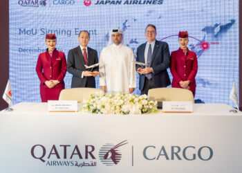 Qatar Airways Cargo and Japan Airlines Strengthen Cargo Partnership with MoU, MTB Events. Image shows members of both airlines t the signing ceremony holding model planes.