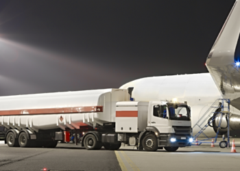 UK Aviation Takes Off Towards a Greener Future, MTB Events. Image shows a plane refuelling on a runway at night.