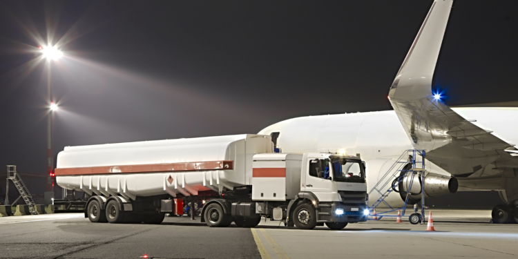 UK Aviation Takes Off Towards a Greener Future, MTB Events. Image shows a plane refuelling on a runway at night.