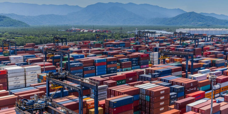 Maersk and DP World sign strategic agreement to expand maritime services at Port of Santos, MTB Events. Image shows lots of colourful containers at a port