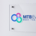 A New Era for MTB Events: Fresh Look, Same Commitment, MTB Events. Image shows the new MTB logo on an acrylic sign on a wall