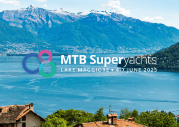 MTB Superyachts powering partnerships on Lake Maggiore , MTB Events. Image shows a view of Lake Maggiore over some houses with mountains in the background