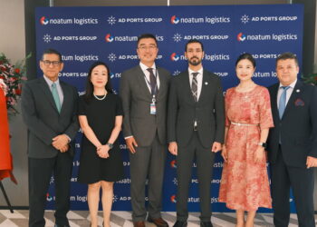 Image shows six people in front of a sign of AD PORTS GROUP and noatum logistics and flowers. AD Ports Group Opens First International Office in China, Signalling Key Step in Global Growth Strategy, MTB Events.