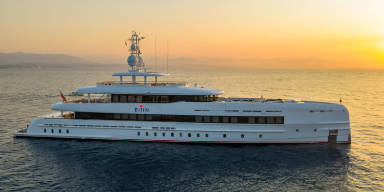 Image photographed by Alessandro Guerreri, shows a superyacht at sunset on sea. Hot Lab unveils striking refit of 50m Heesen superyacht Bijin.