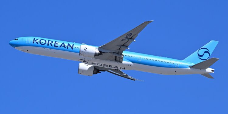 Image shows Korean Air Boeing 777-300ER HL8008, in the new Korean Air livery, departs Boston as flight 92 to Seoul-Incheon after taking off from runway 33L. Korean Air Announces Major Fleet Investment with Boeing, GE Aerospace, and CFM International, MTB Events. 4300streetcar, CC BY 4.0 , via Wikimedia Commons