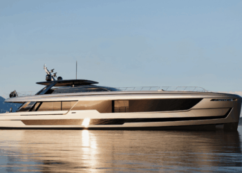 Image shows a beige 46 meter superyacht on water with a mountain in the background. Van der Valk Begins Construction on 48-Metre Flagship “Project ZEN”, MTB Events.