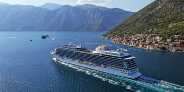 Image shows the cruise ship sailing on a large river between two mountains. Oceania Allura Sets a New Benchmark in Marine Luxury Design, MTB Events.