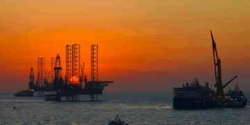 Image shows an oil rig and vessel at sunset with a colourful sky. BLÜCHER Strengthens Support for Greek and Cypriot Marine Markets Through Partnership with OCEANDYNAMIC, MTB Events.