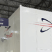 Image shows inside a warehouse building with a large white wall with the text Flight Power, alongside their logo. A Visit to Flight Power’s Plant 98 — Reflections from Holly, MTB Events, MTB Events.