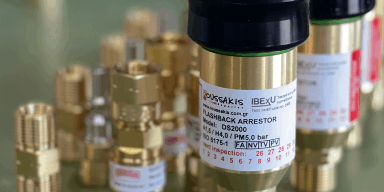 Image shows a collection of gold parts standing on a table with the tag, Flashback Arrestor. Roussakis Supplies Expands Global Reach Following Successful Engagement at MTB Marine Europe, MTB Events.