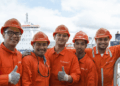 Image shows five crew members in orange jumpsuits and hard hats, at a port. Albireo, a New Crewing Venture Established by Harren Group and NSB Group, MTB Events.