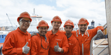 Image shows five crew members in orange jumpsuits and hard hats, at a port. Albireo, a New Crewing Venture Established by Harren Group and NSB Group, MTB Events.