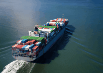 Image shows a container ship at sea. Eutelsat and Can Marine Join Forces to Enhance Maritime Connectivity with OneWeb LEO, MTB Events.