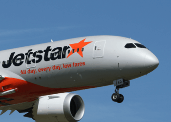 Image shows the front half of an airplane with the Jetstar livery, in the sky. Jetstar Japan Ownership Change Signals Shift in Japan’s LCC Market, MTB Events.