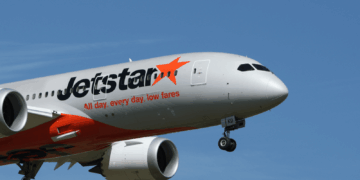 Image shows the front half of an airplane with the Jetstar livery, in the sky. Jetstar Japan Ownership Change Signals Shift in Japan’s LCC Market, MTB Events.